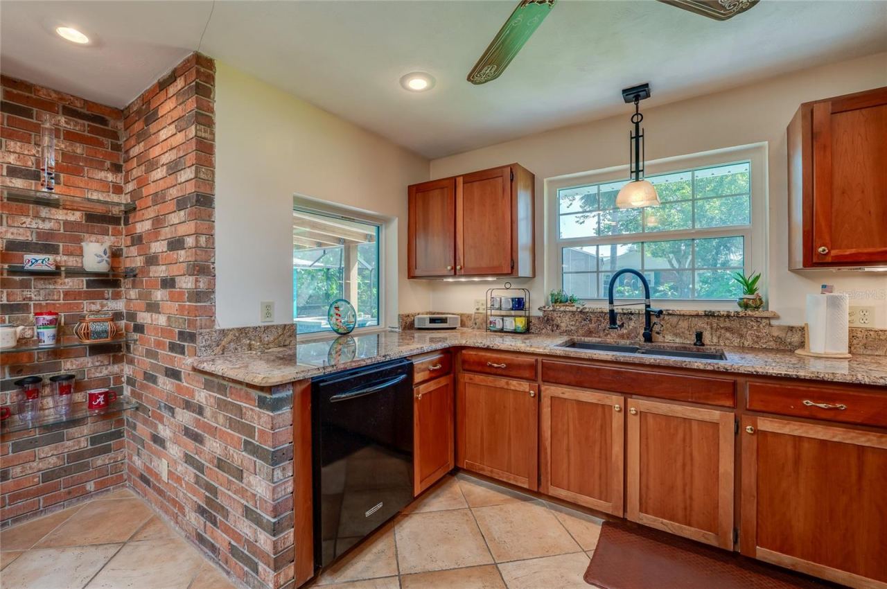 Photo 12 of 20: Kitchen with views to pool and backyard