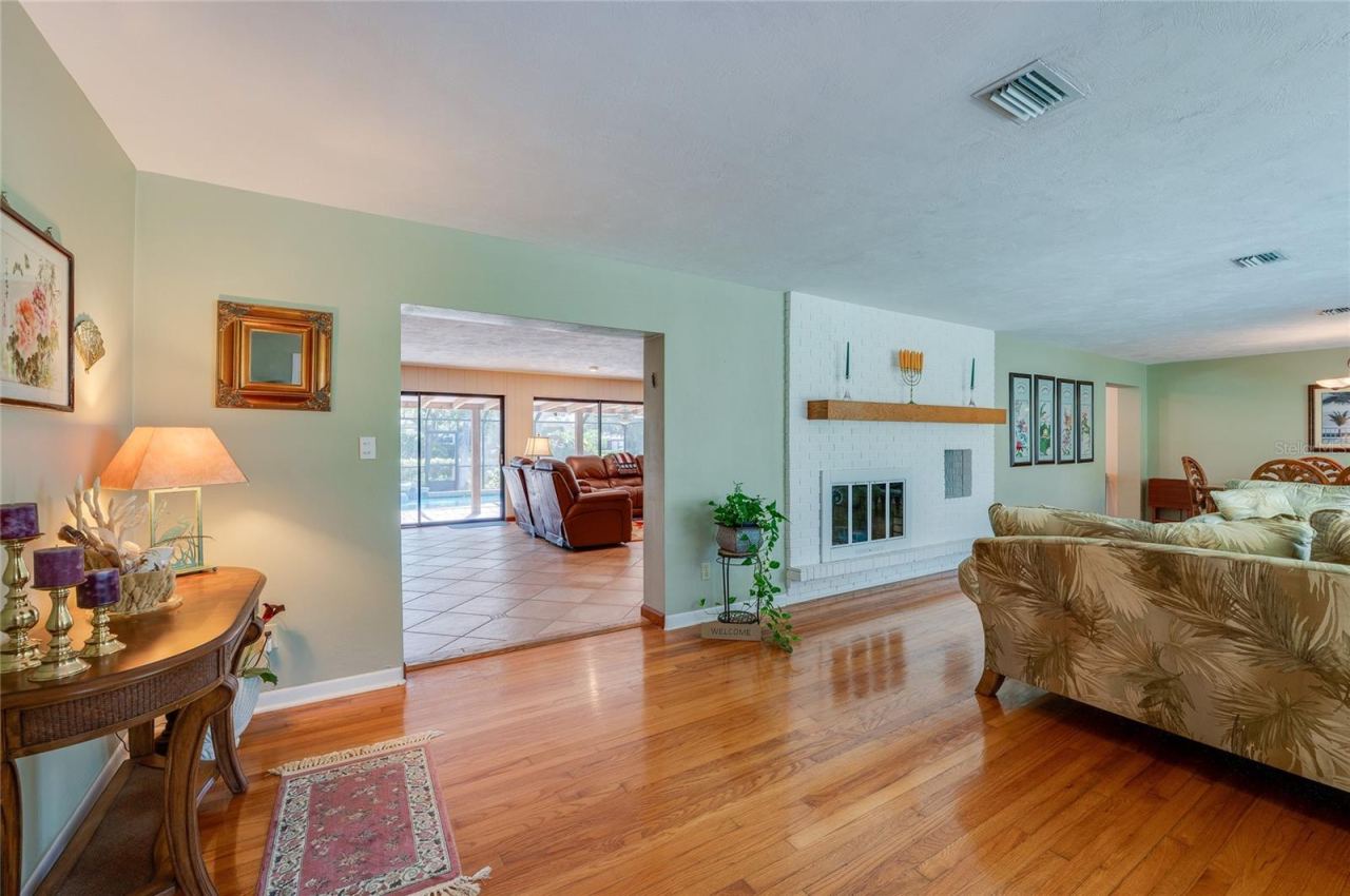Photo 16 of 20: View from kitchen to family room with double-sided fireplace