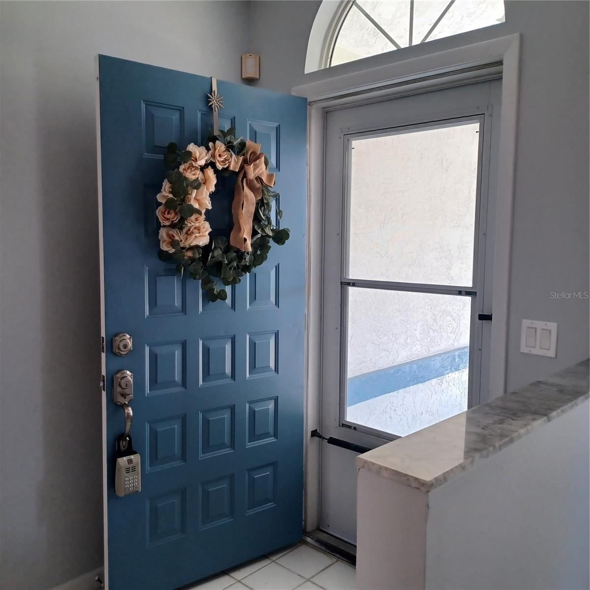 Photo 20 of 20: Front door with storm door.