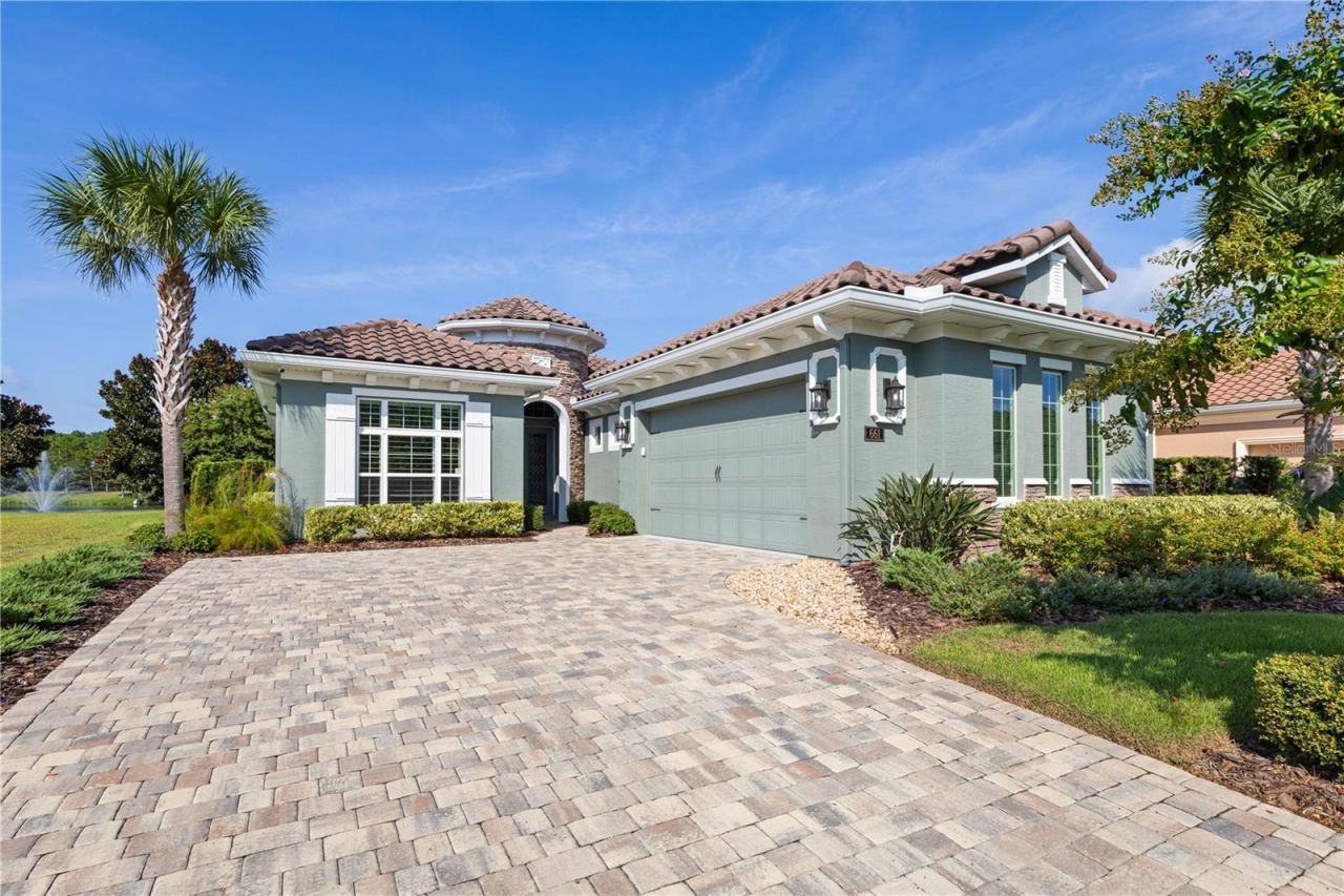 Photo 11 of 20: Beautiful paved long driveway to side entry Garage