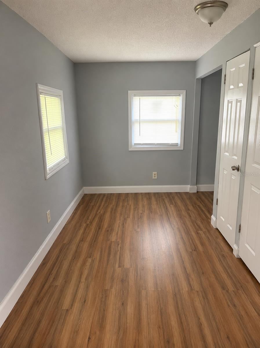 Photo 9 of 15: bedroom #3, flex room, office, playroom, gym, -- this room has an exterior door to the backyard. Laundry closet is in this room.