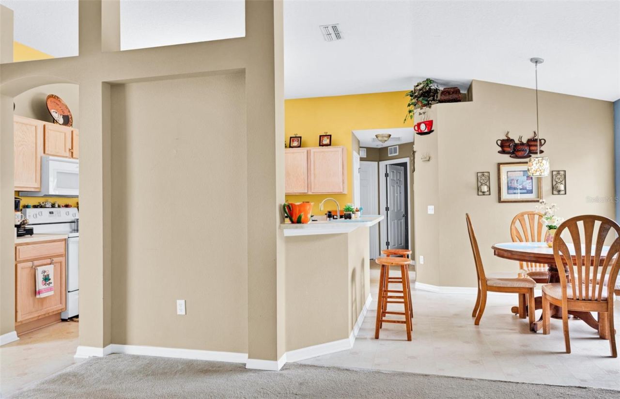 Photo 11 of 20: View of kitchen and breakfast area from living room