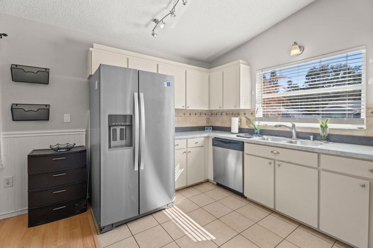Photo 12 of 20: Open Kitchen with newer stainless steel appliances.