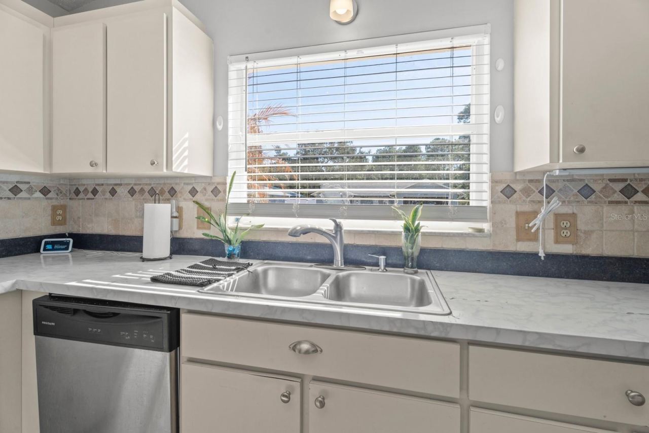 Photo 13 of 20: Open Kitchen with newer stainless steel appliances.