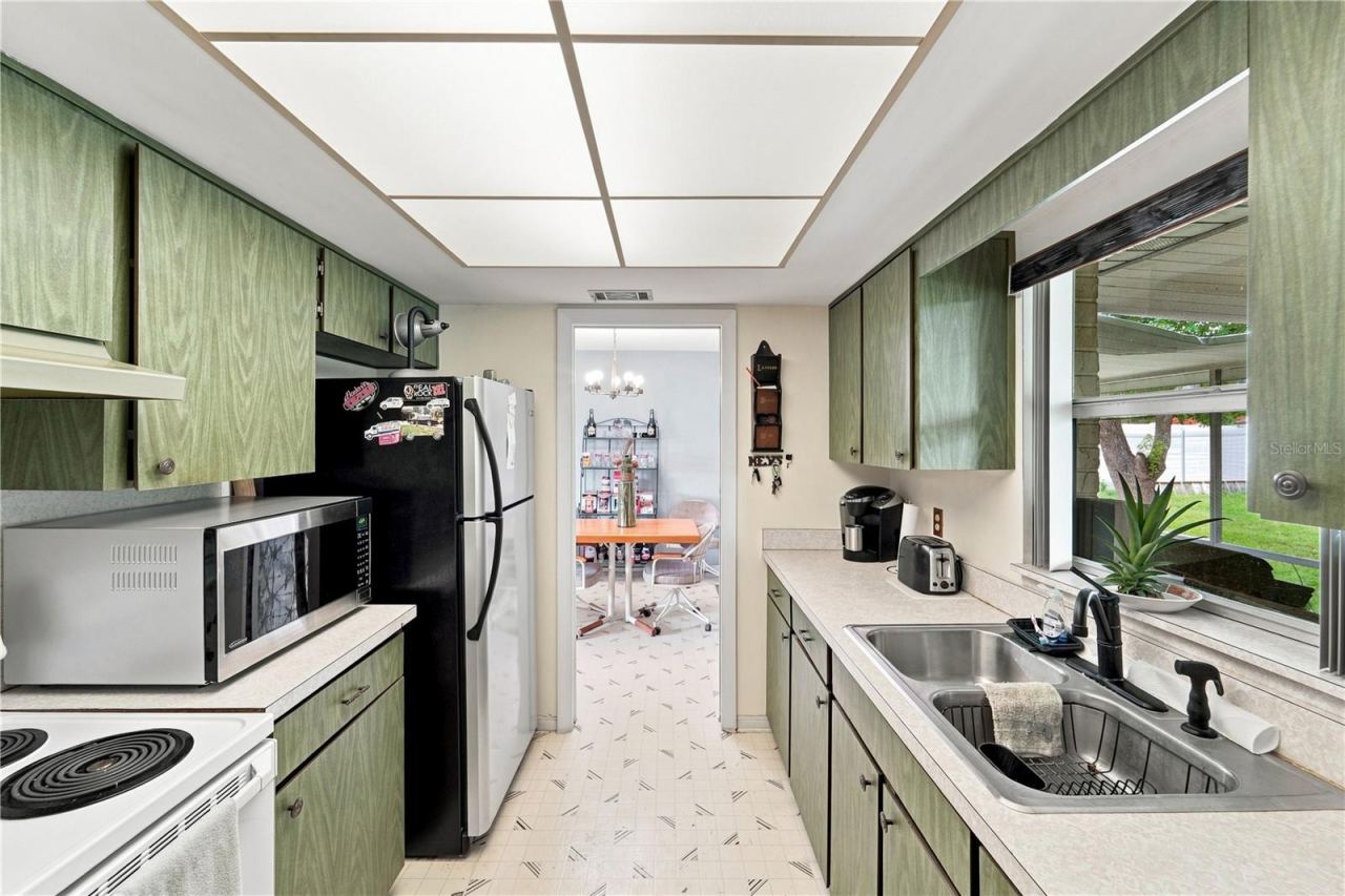 Photo 6 of 16: A second look at the kitchen showcases the functional layout and storage.