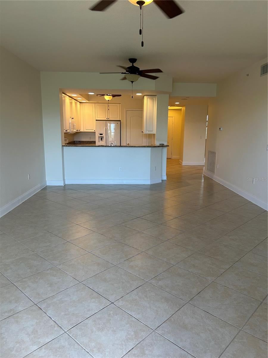 Photo 17 of 20: Open floorplan, tiled floors throughout.