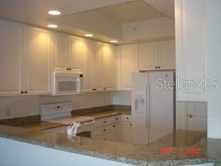 Photo 12 of 20: Gourmet kitchen with granite & lots of cabinets & drawers,