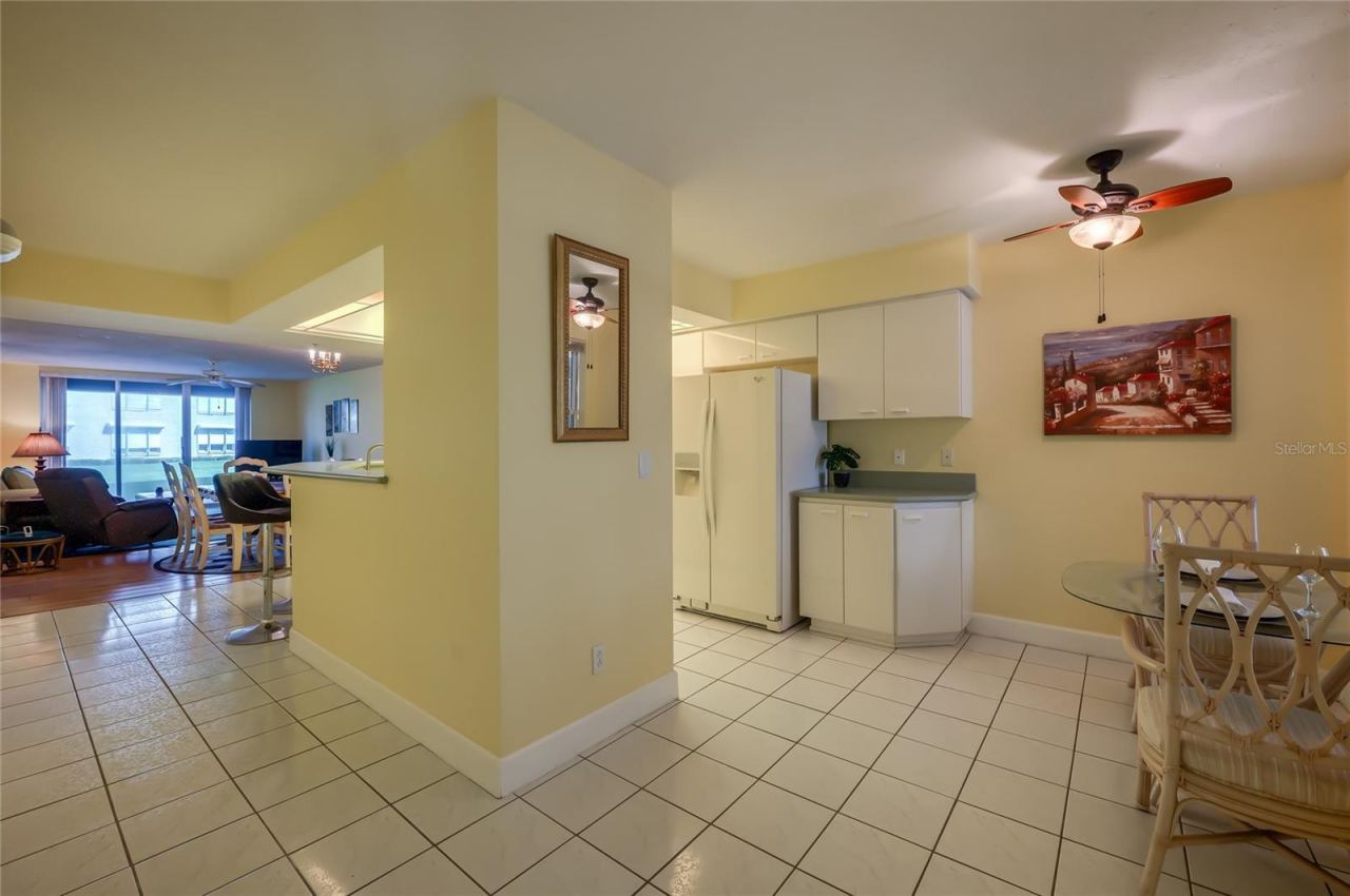 Photo 11 of 20: This open-concept kitchen flows effortlessly into the dining space, featuring ample cabinetry, generous counter space, and a functional layout perfect for everyday living and entertaining.