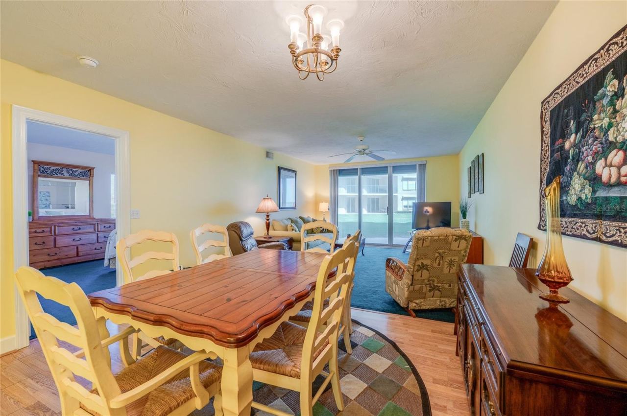 Photo 18 of 20: A dedicated dining space with a stylish chandelier and ample room for a full-size table, seamlessly connected to the living area for easy entertaining.