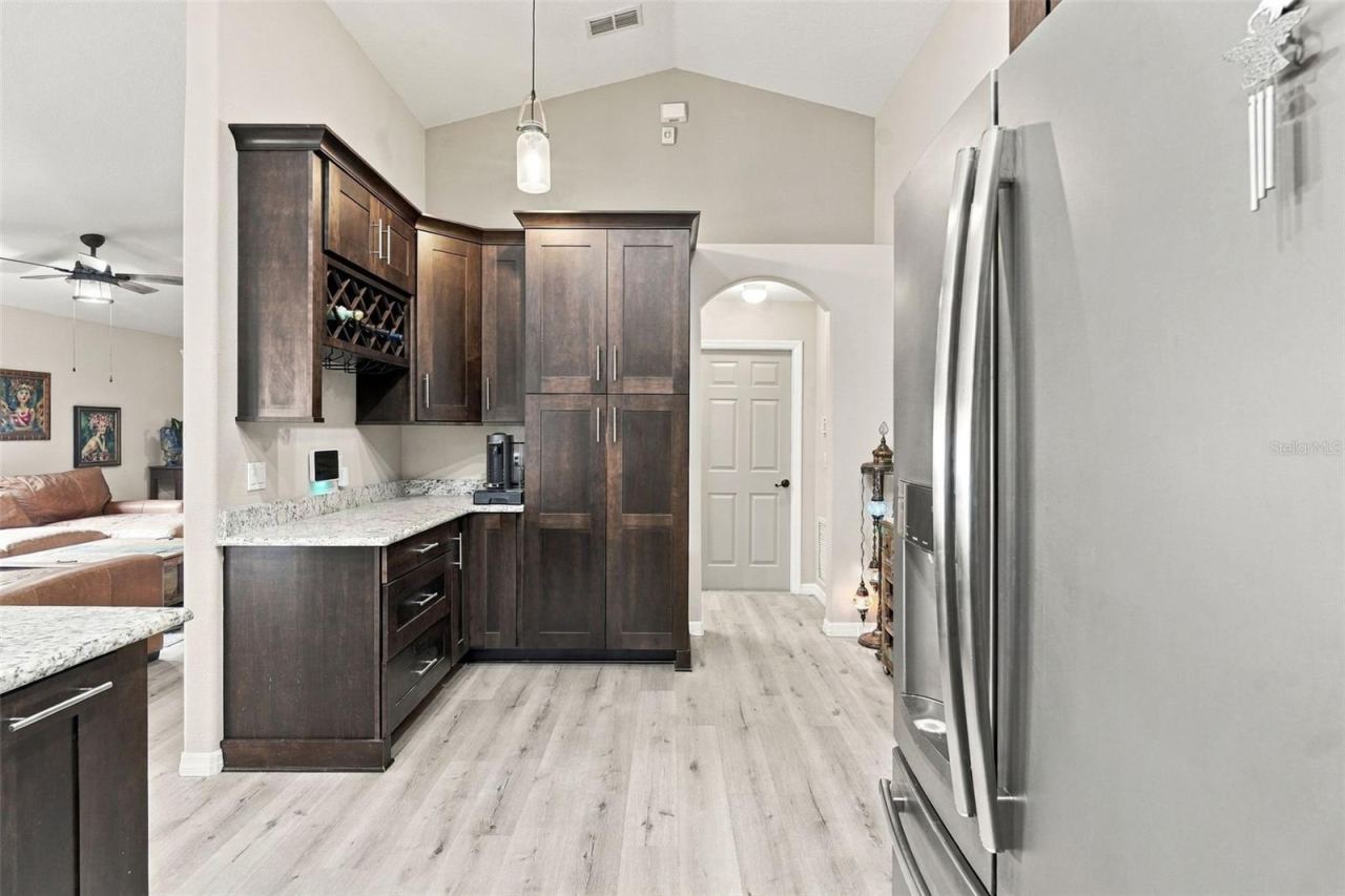 Photo 8 of 20: Kitchen towards wine rack, pantry, and laundry room/garage.