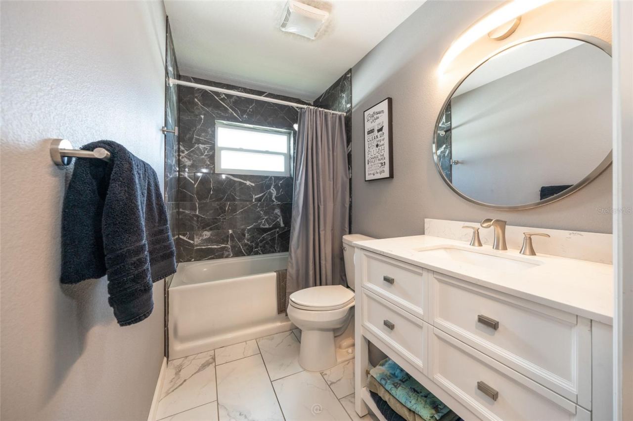 Photo 17 of 20: Guest bath with tub & window for natural light