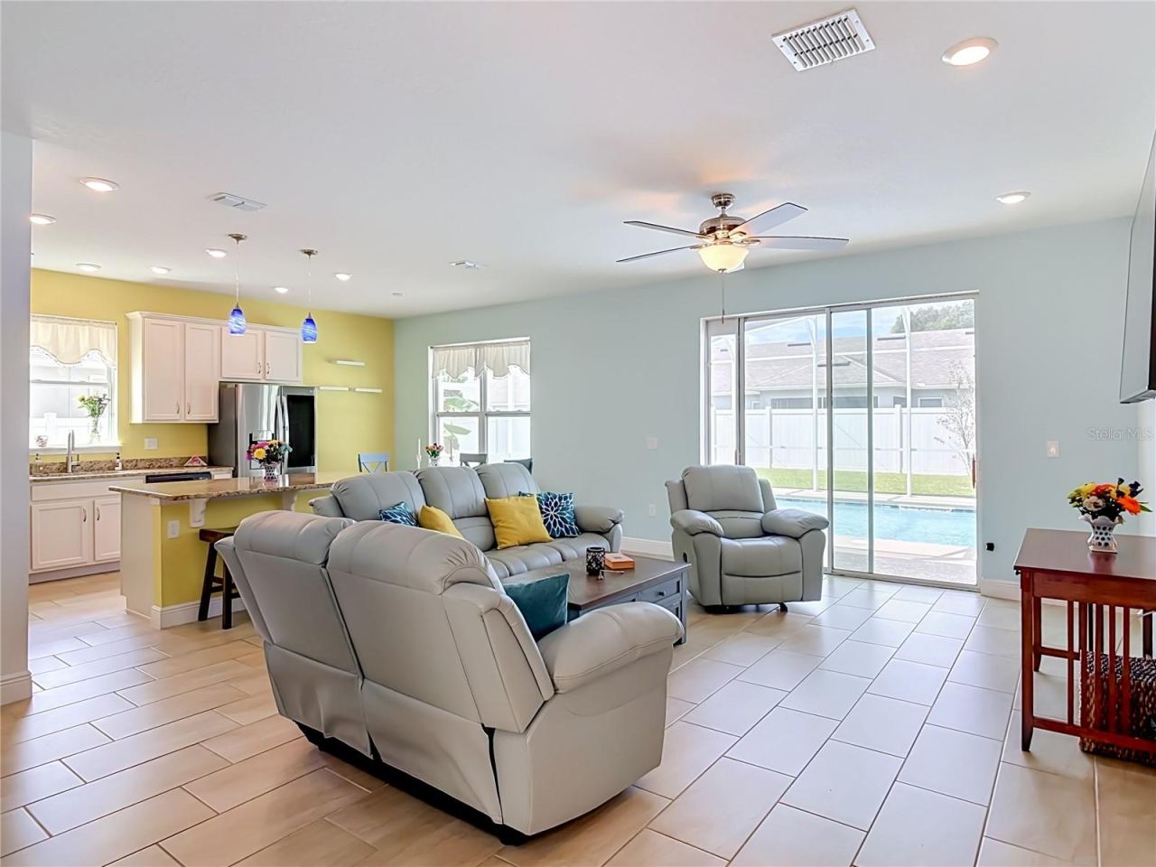 Photo 3 of 20: Living room sliders to lanai and pool with pet door