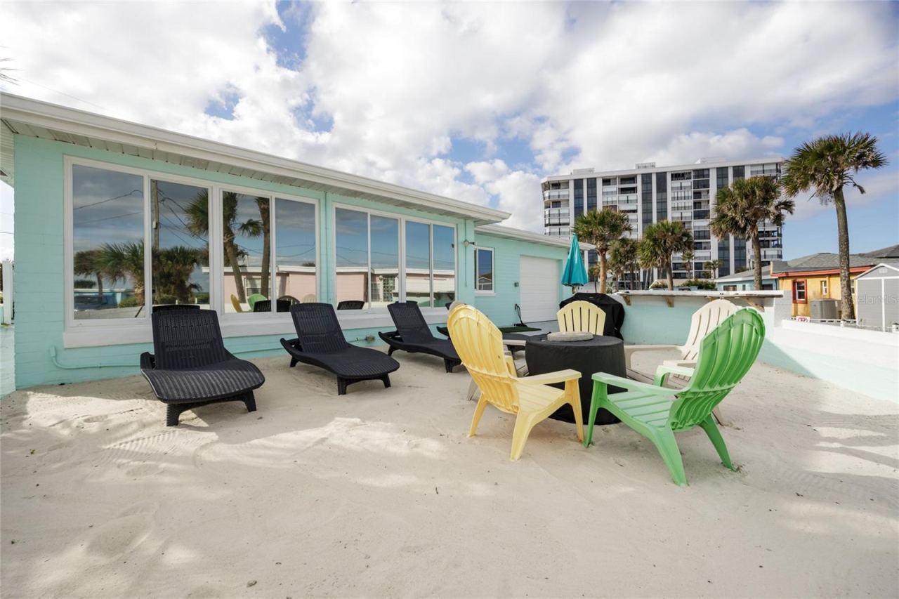 Photo 9 of 20: Back yard with beach sand, beach view, grill, and bar top