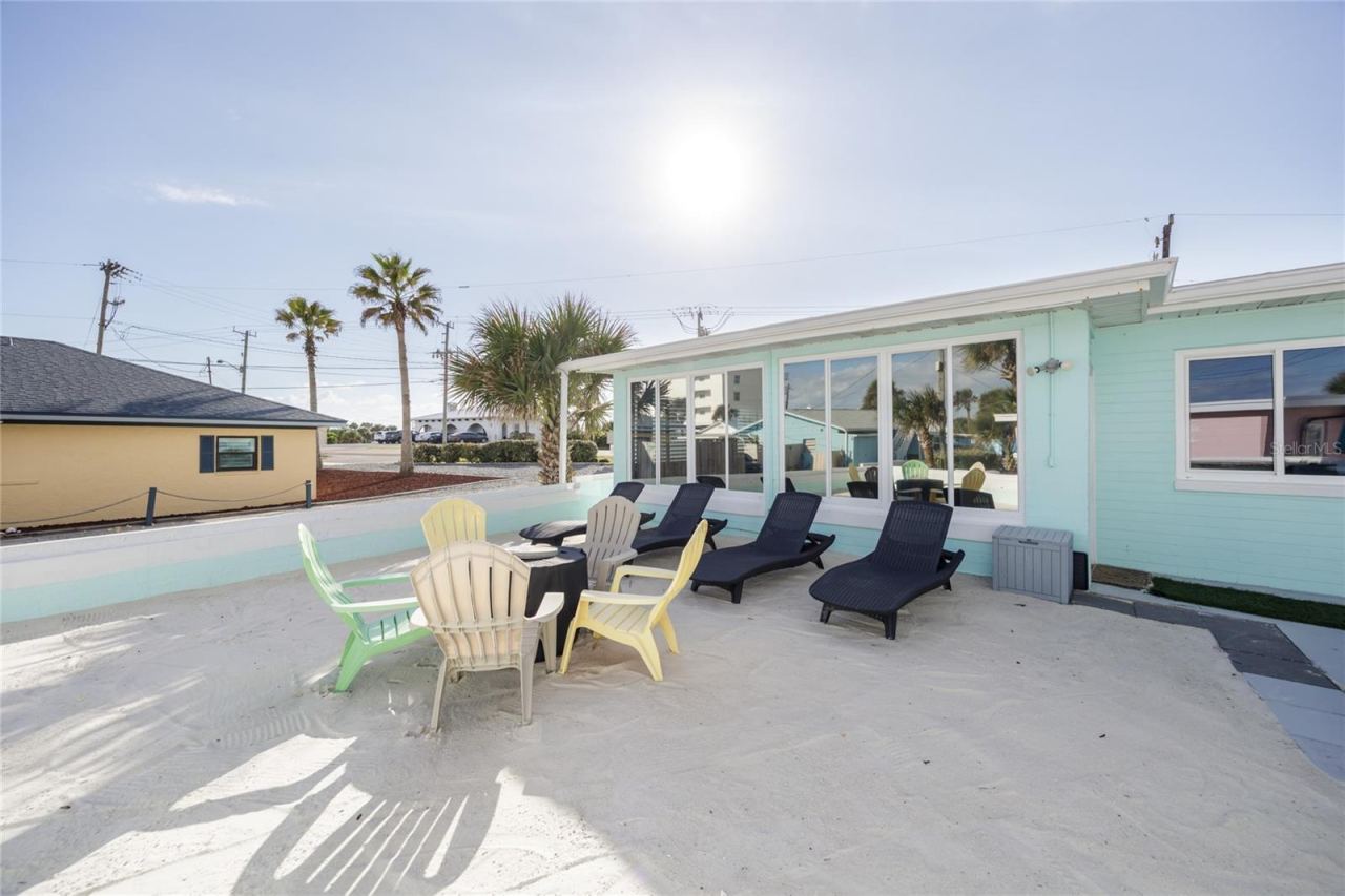 Photo 8 of 20: Back yard with beach sand, beach view, grill, and bar top