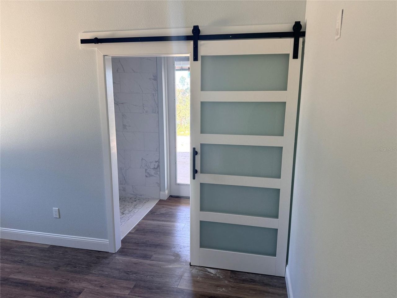 Photo 9 of 20: Barn Door to Rear Primary Bath
