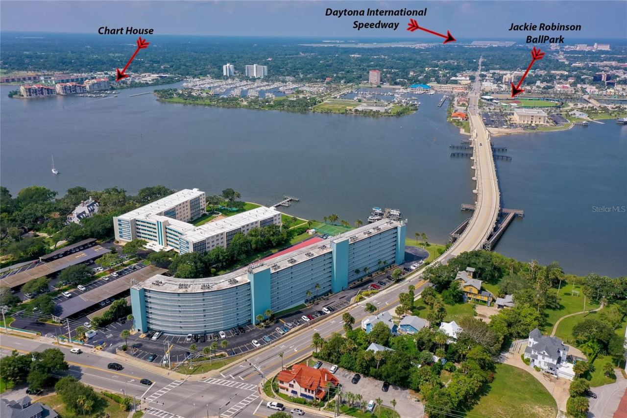 Photo 2 of 20: Expansive view of the surrounding area, showcasing nearby waterways, residential neighborhoods, and coastal access.
