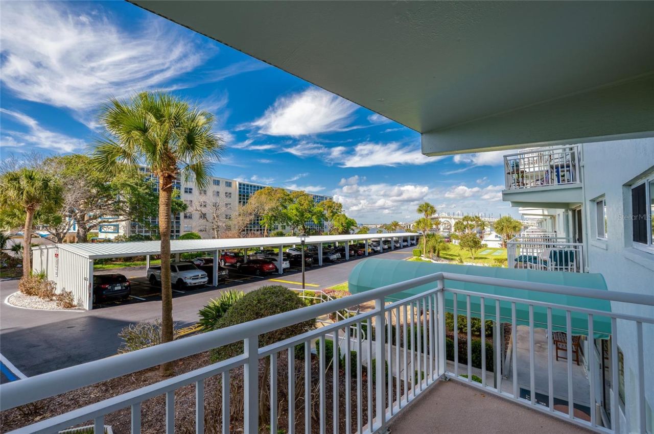 Photo 13 of 20: Elevated views of the surrounding grounds with glimpses of the water and lush tropical landscaping.