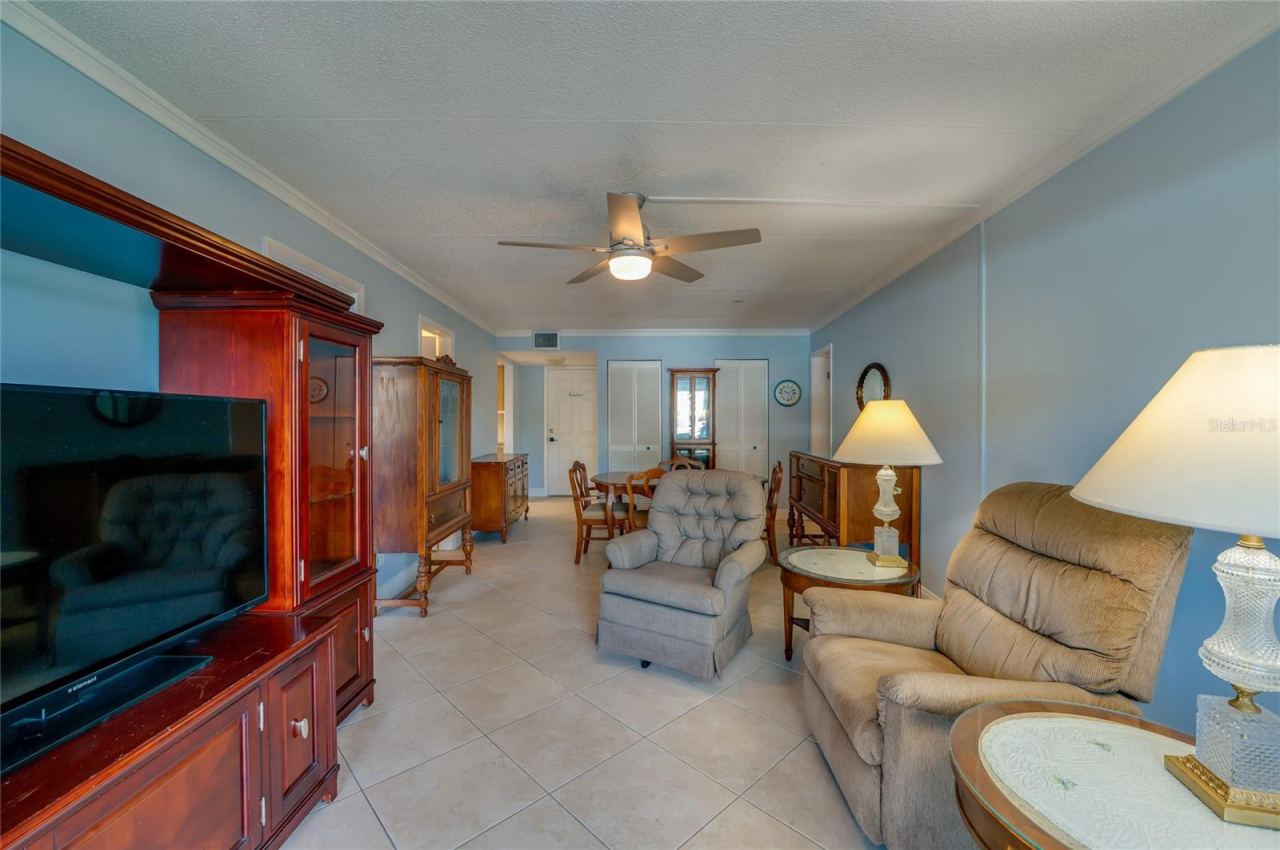Photo 7 of 20: Spacious layout offering multiple seating options and an easy flow into the dining area, perfect for relaxing or hosting guests.