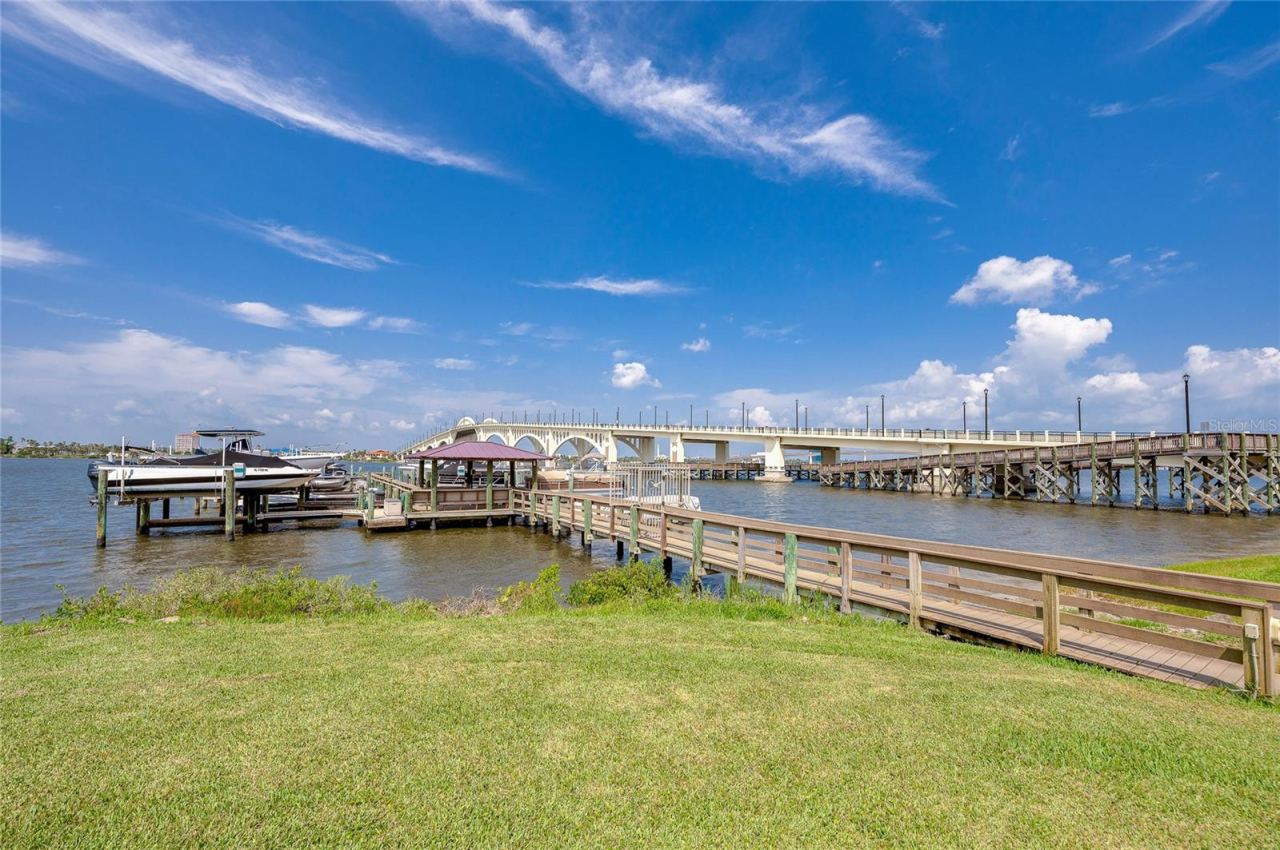 Photo 3 of 20: Expansive water views highlighted by a nearby bridge, creating a picturesque and relaxing backdrop.