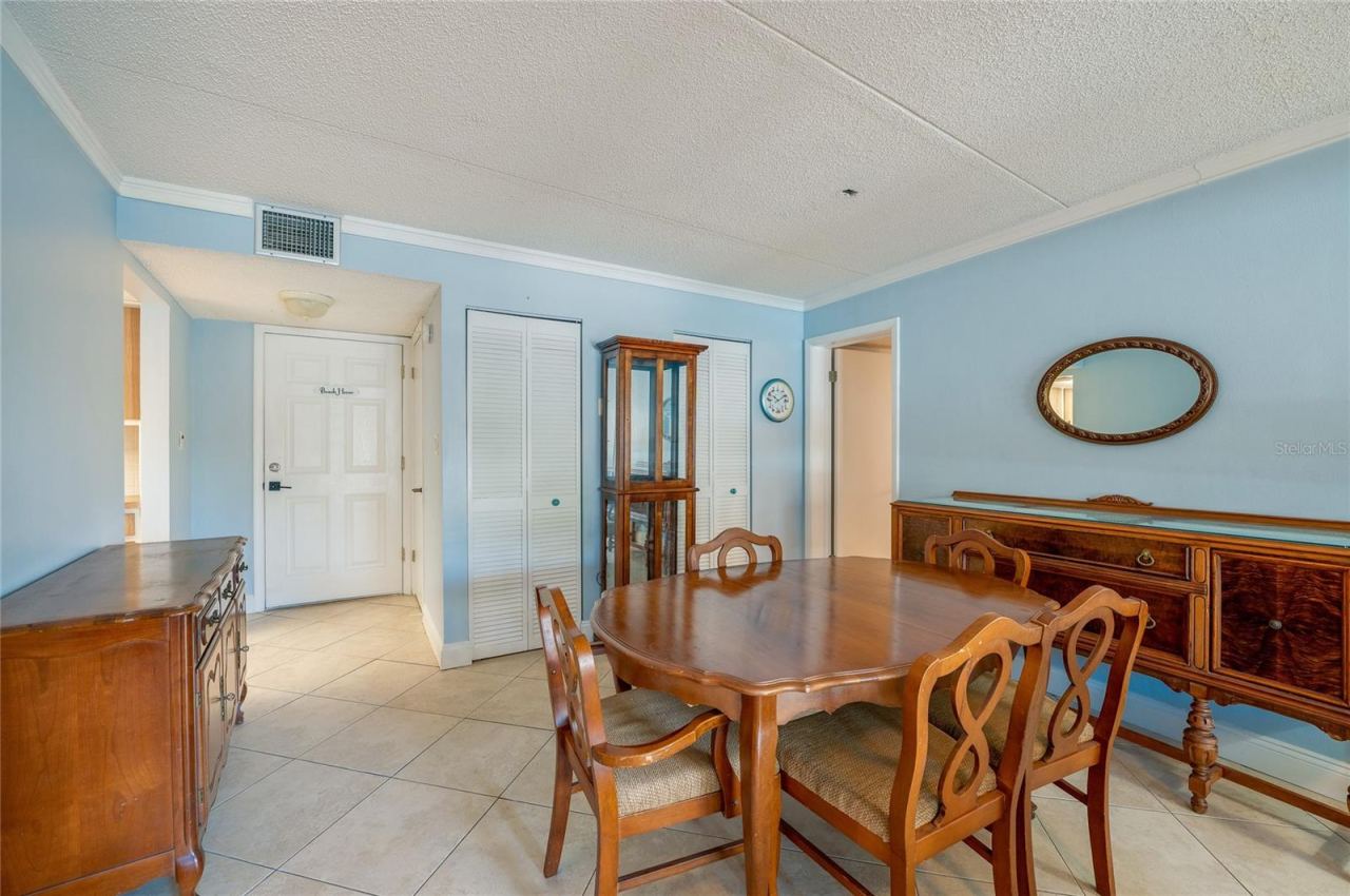 Photo 9 of 20: Another perspective highlighting the layout, tile flooring, and convenient proximity to the kitchen and entry.