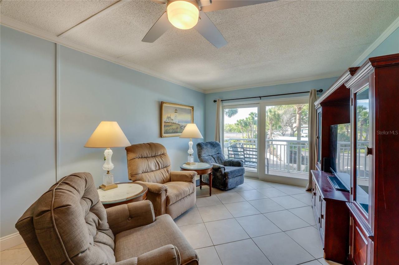 Photo 6 of 20: Comfortable living area with large sliding glass doors that fill the space with natural light and provide access to the private balcony.