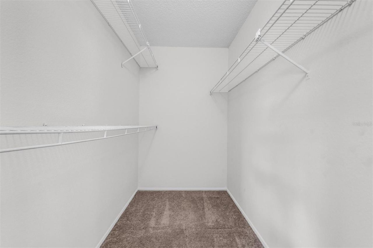Photo 9 of 17: Primary walk-in closet