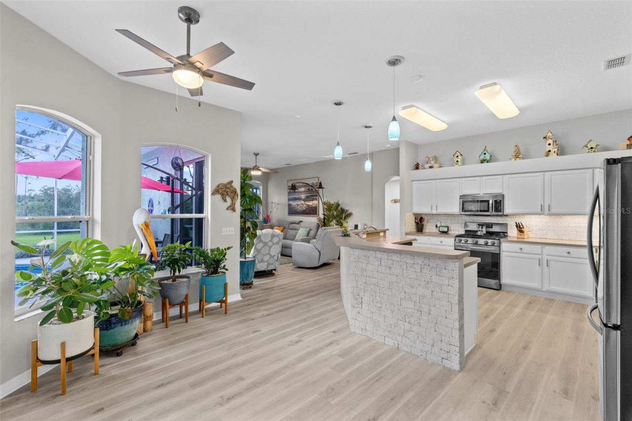 Photo 9 of 20: Kitchen w. Bar and Eating Area