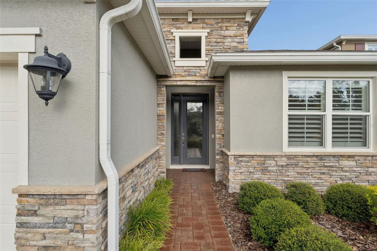 Photo 2 of 20: Front entryway w/ a glass front door & side light