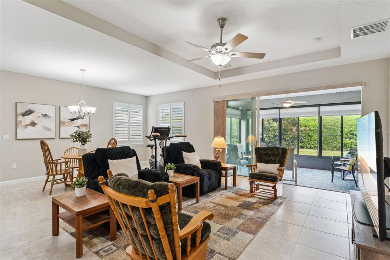 Photo 11 of 20: View of the Enclosed Lanai w/ sliding glass windows & pull down shades from the Great Room area