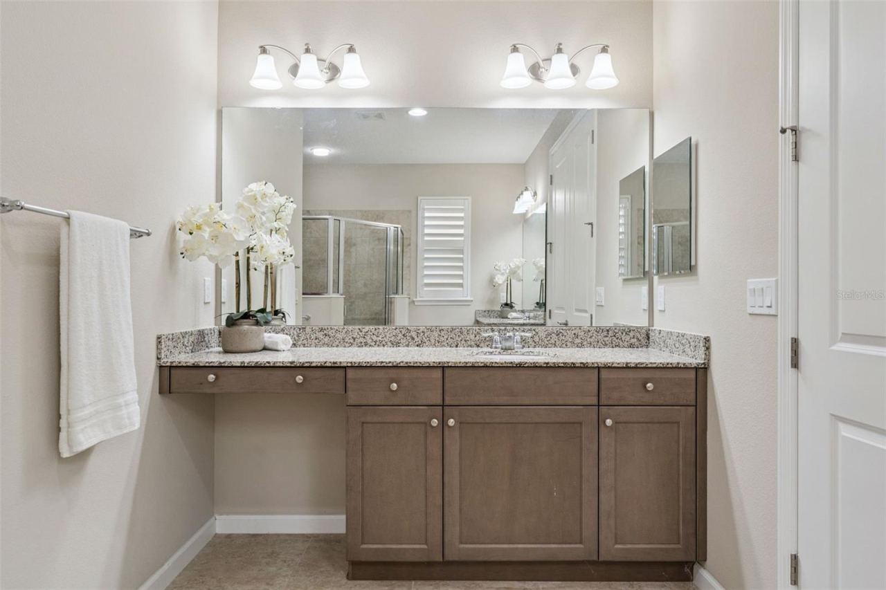 Photo 20 of 20: 1 of 2 Primary Bathroom vanities w/ a granite countertop