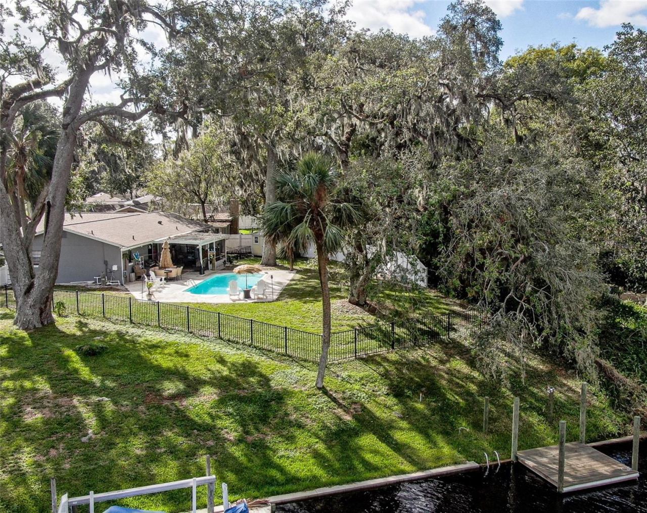 Photo 1 of 18: Large backyard PARADISE with dock and pool!
