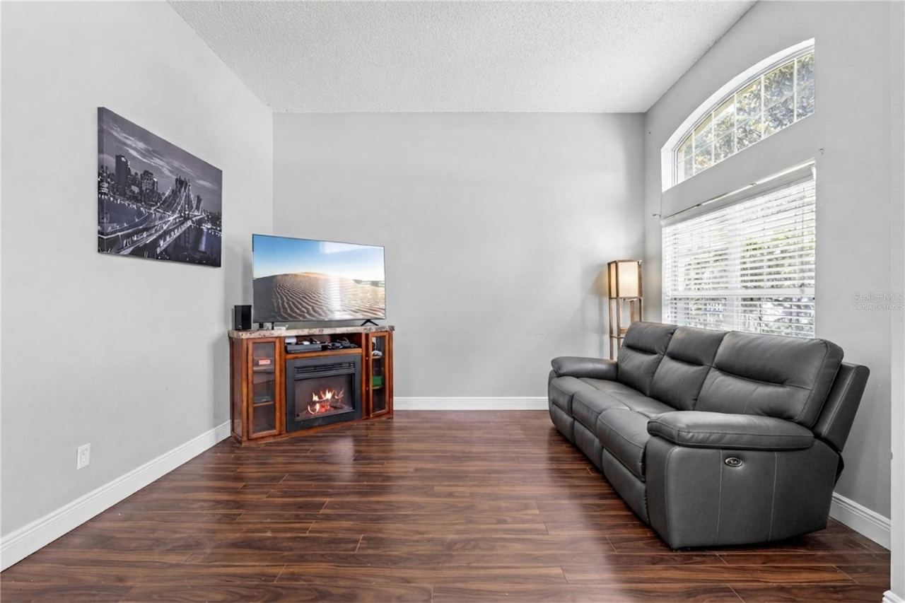 Photo 10 of 20: Living room with tall ceilings. Virtually staged.