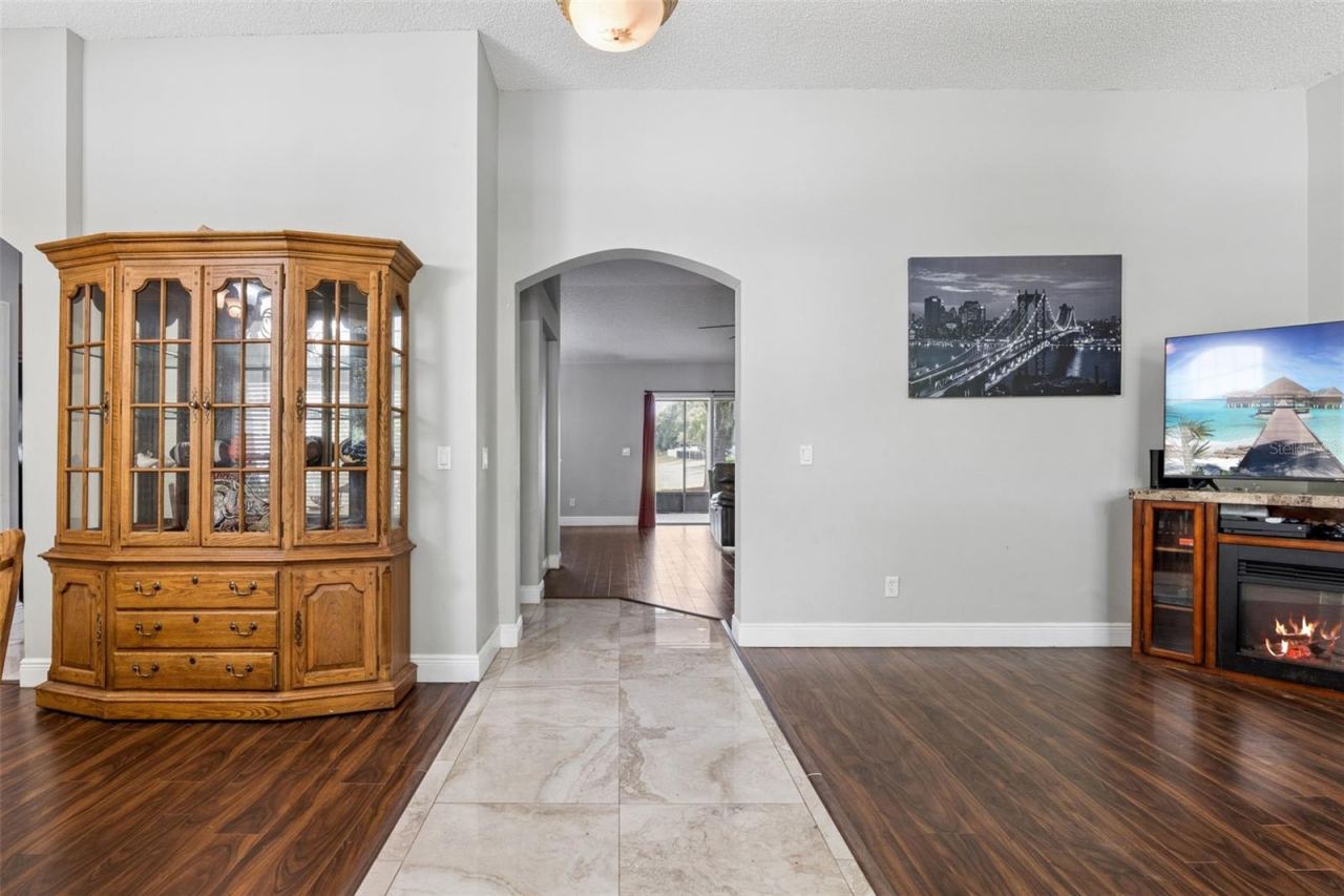 Photo 6 of 20: Bright, open foyer with marble floors leading directly into an airy, spacious main living area.