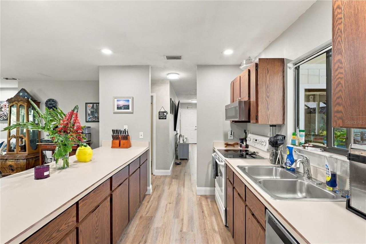 Photo 15 of 20: View from Refrigerator to Front Door, Another Living/Dining Area is on the Left!