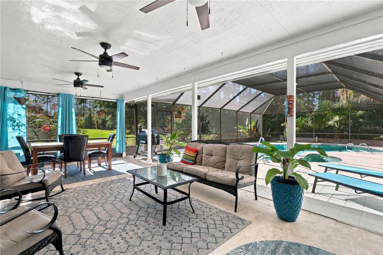 Photo 2 of 20: Stunning Outdoor Covered Lanai, Screened Pool & Spa! Florida Living!