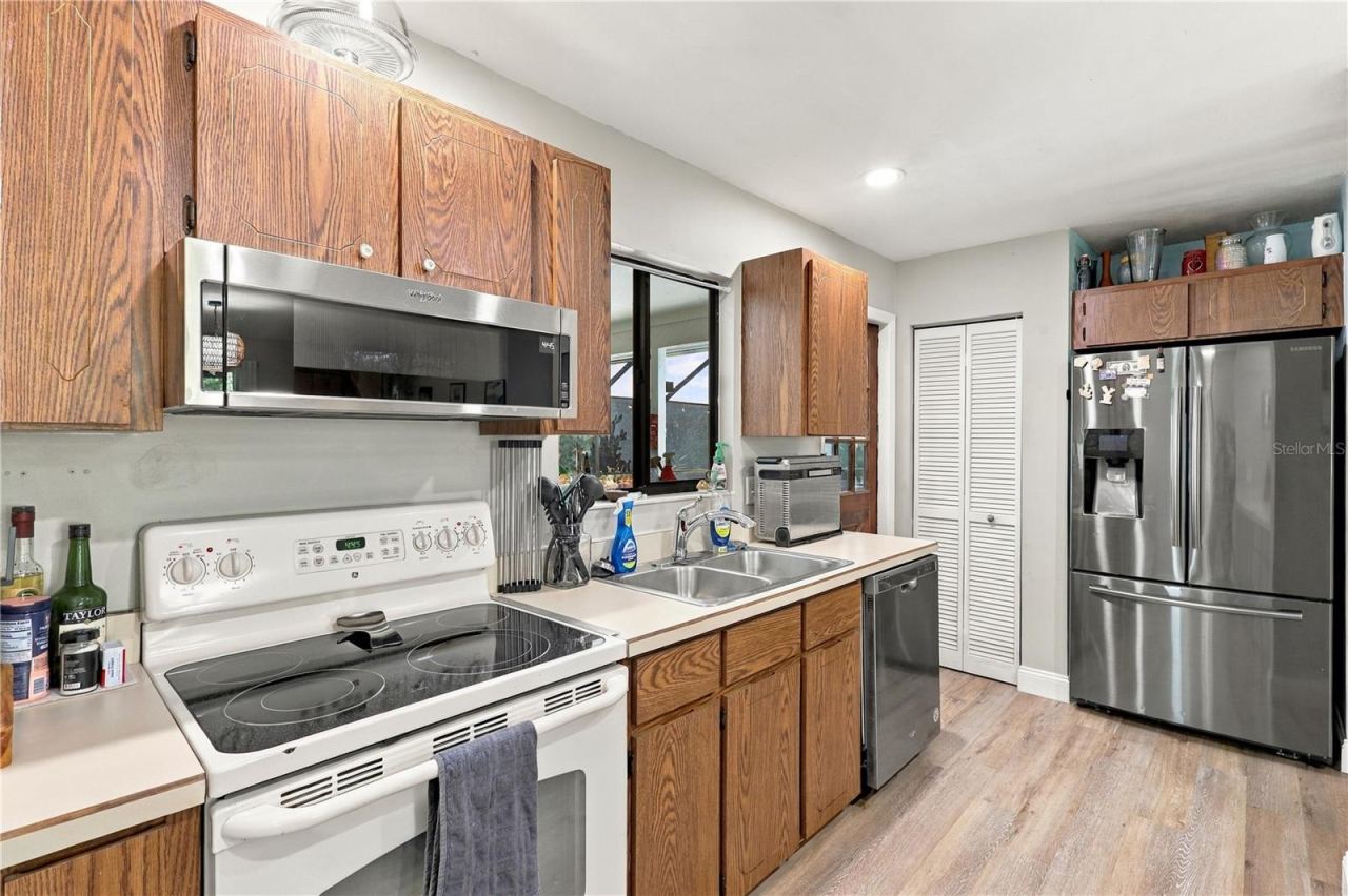 Photo 13 of 20: Kitchen, Closet Pantry, Stainless Steel Refrigerator, Dishwasher & Microwave.