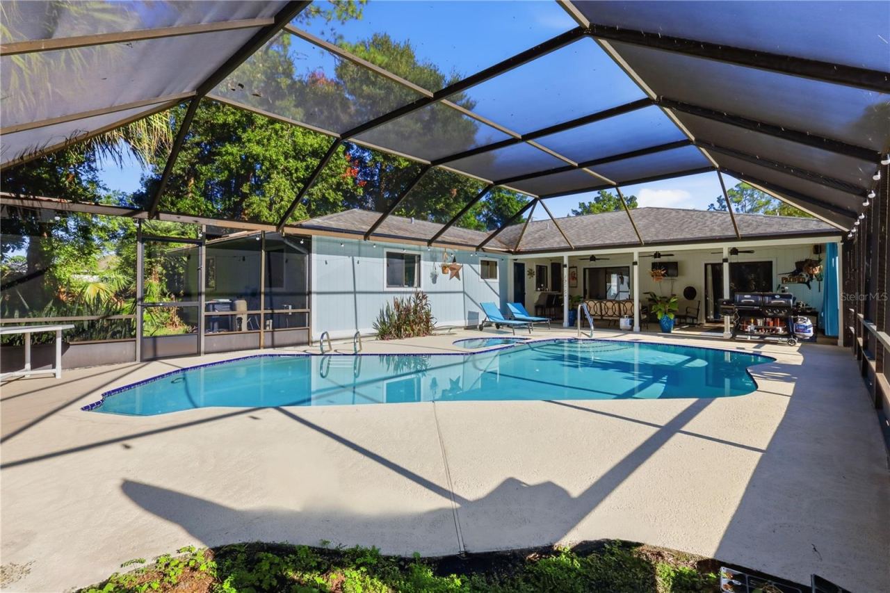 Photo 5 of 20: Beautiful View of the Pool, Spa & Covered Lanai.