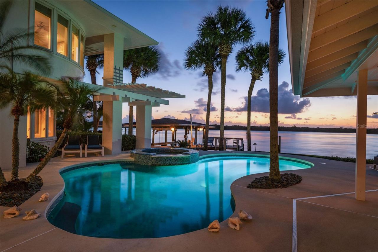 Photo 5 of 20: 1215 Commodore Dr. Your Own Private Water Front Resort. Magical at Every Time of Day!