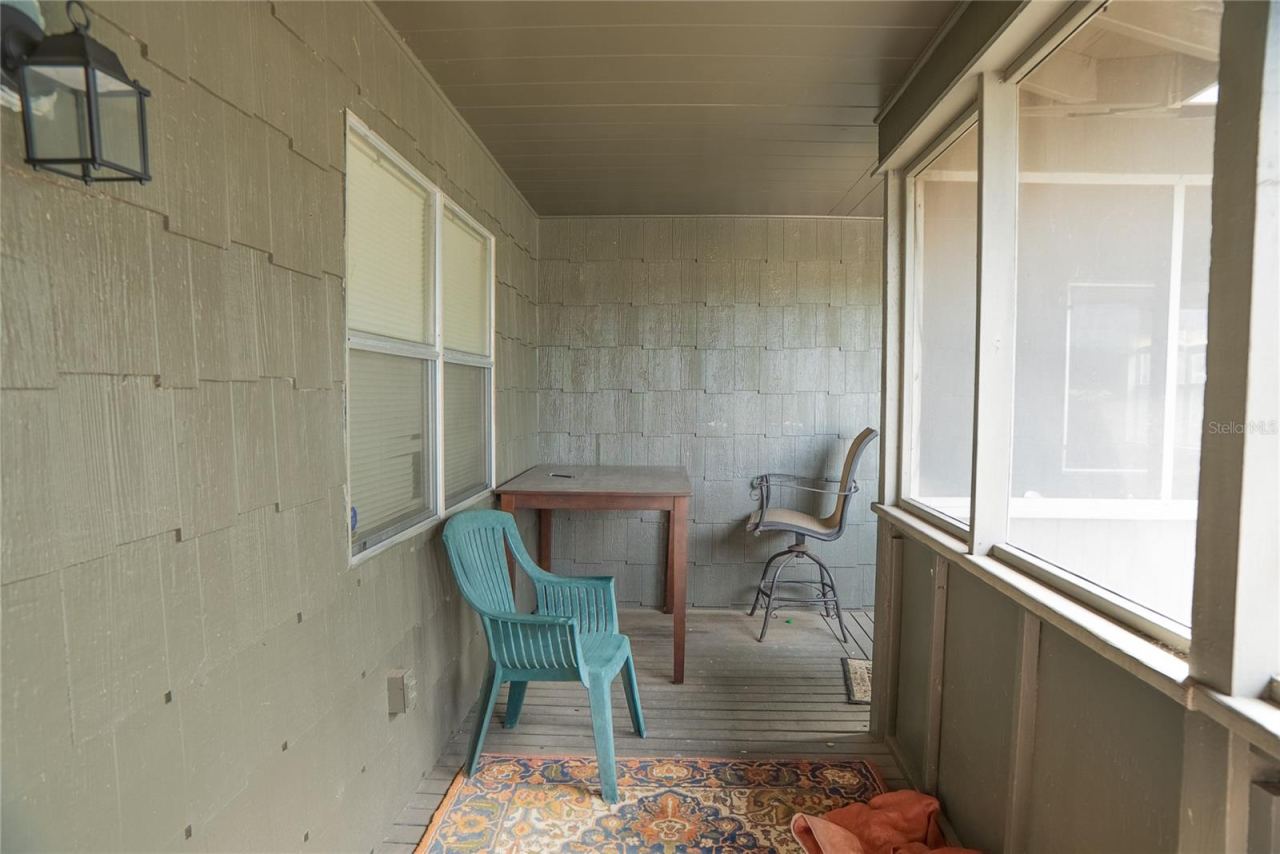 Photo 7 of 20: Wrap around front porch, screened in