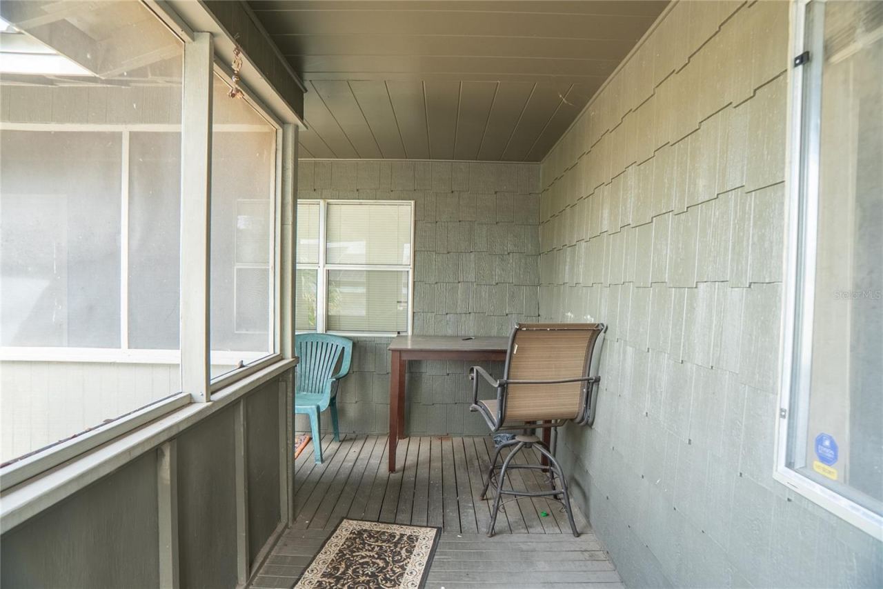 Photo 6 of 20: Wrap around front porch, screened in