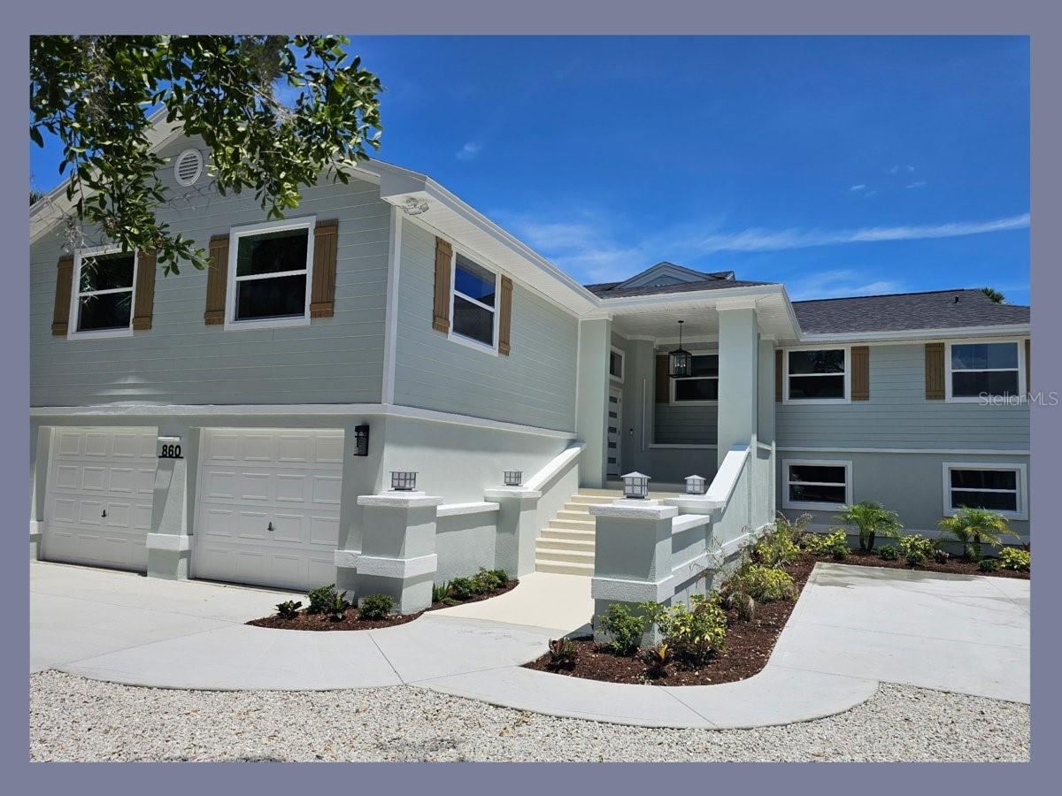 Photo 2 of 20: Front of Home with new Roof, Hardie Siding, and Concrete Driveway