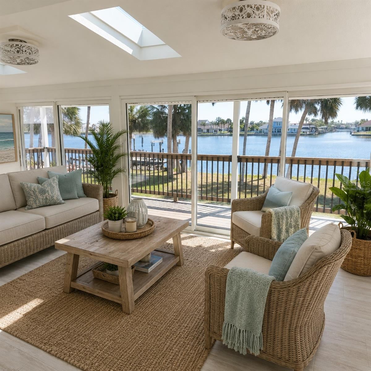Photo 14 of 20: Virtually Staged. The Florida Room with a wall of sliding doors you can open up to to enjoy the breeze of the water.