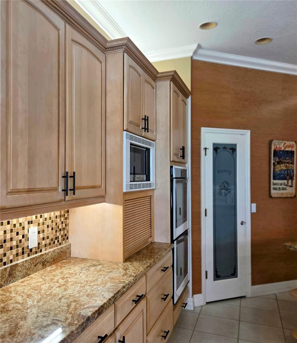 Photo 14 of 20: Pull down door to hide some appliance and large walk in pantry