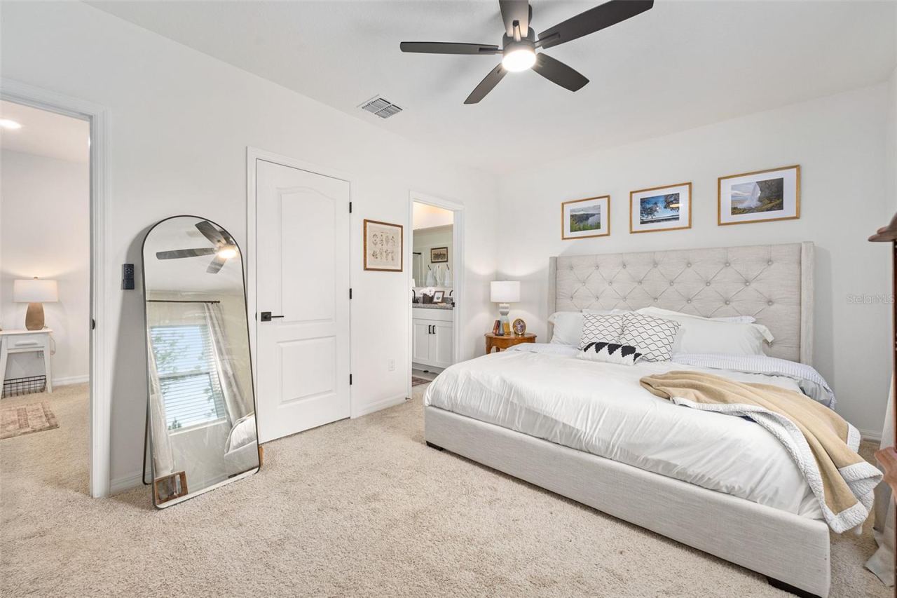 Photo 19 of 20: Primary bedroom, ceiling fan added