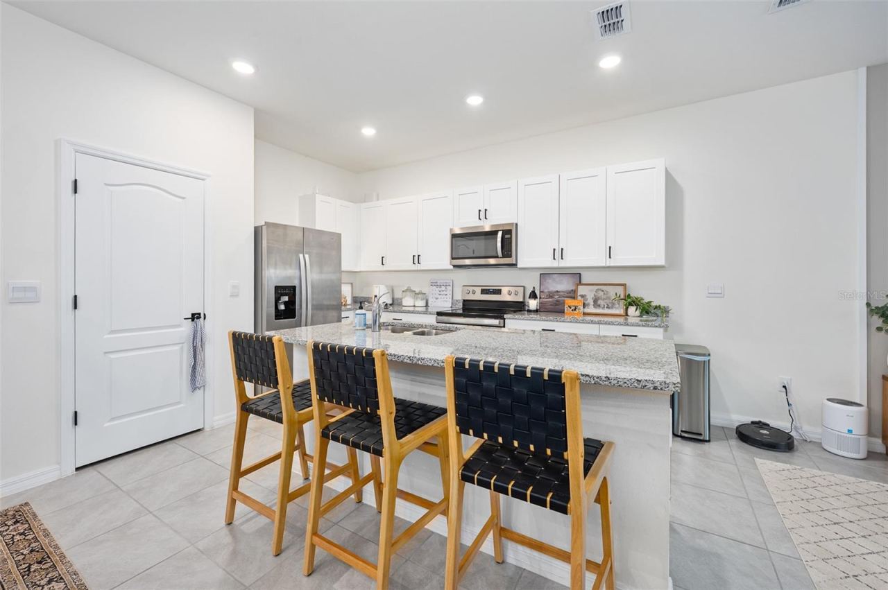 Photo 8 of 20: Island with barstool seating, pantry door