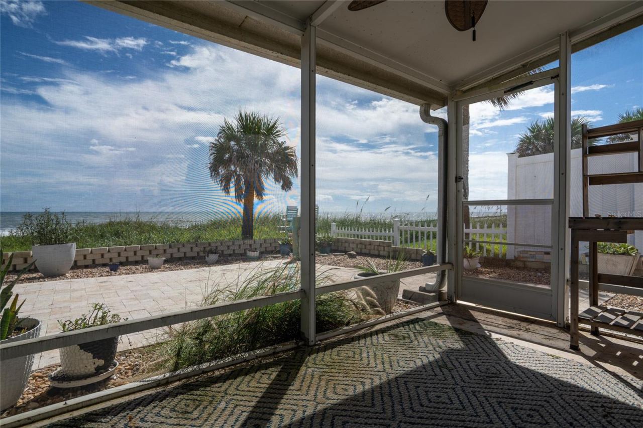 Photo 5 of 20: Screened in patio off primary bedroom and Florida room!