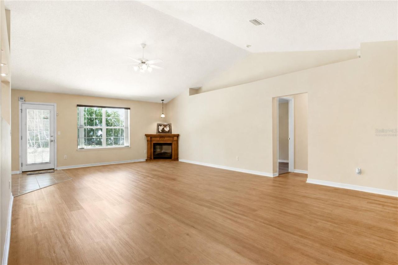 Photo 8 of 20: Virtually staged: Great Room without pool table and light from the Front Entrance