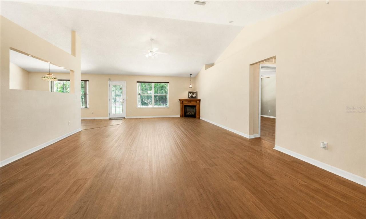 Photo 7 of 20: Virtually Staged Front Entrance View to Great Room without Light and Pool Table
