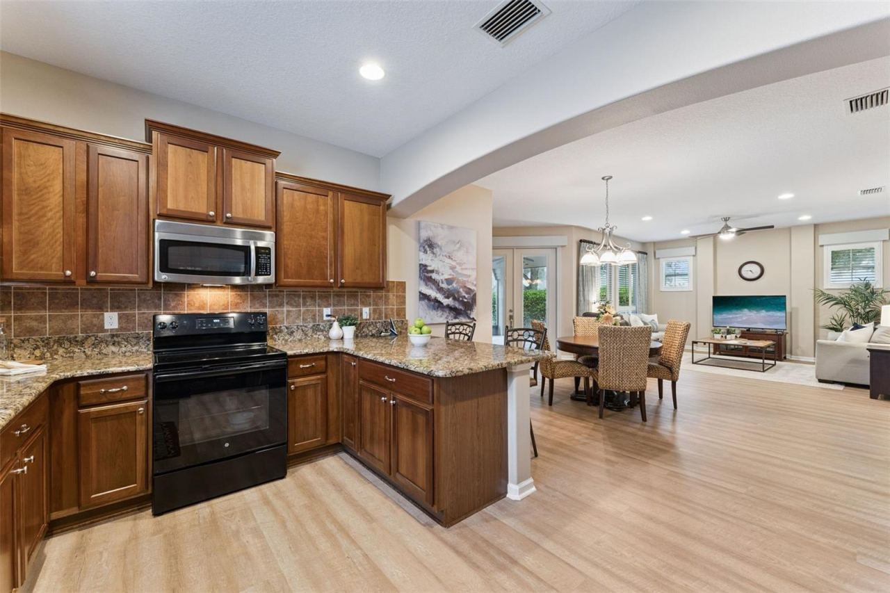 Photo 8 of 20: View from the Kitchen to the Dining & Great Room areas
