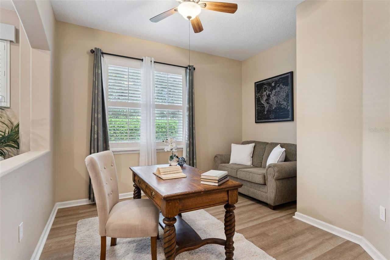 Photo 14 of 20: 11' x 12' Den/office w/ luxury vinyl flooring & a ceiling fan